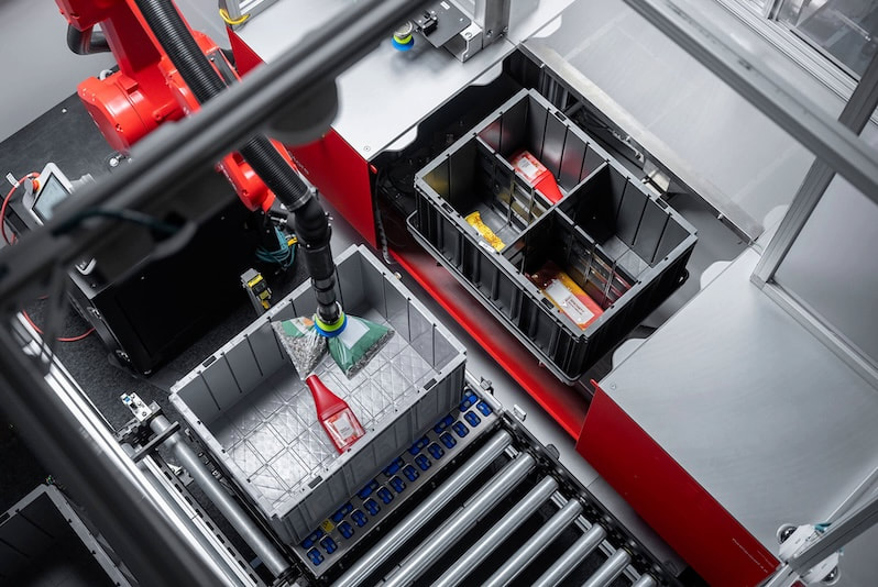 Render of a automated  picking system gripping items